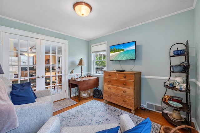 7 Wilson Blvd, Poughkeepsie, NY 12603 - living room featuring french doors, wood finished floors, crown molding, and baseboards