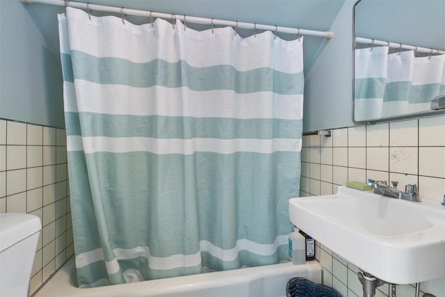 7 Wilson Blvd, Poughkeepsie, NY 12603 - full bathroom with tile walls, a sink, toilet, and shower / tub combo