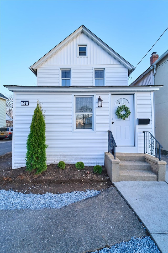 bungalow-style house featuring board and batten siding