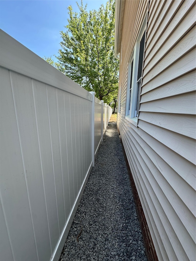view of home's exterior with fence