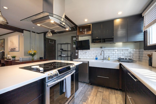 108 Wayne Ave, White Plains, NY 10606 - kitchen with tasteful backsplash, light countertops, stainless steel electric range, and light wood finished floors