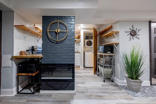 108 Wayne Ave, White Plains, NY 10606 - interior space featuring stacked washer / drying machine, light wood-type flooring, and baseboards