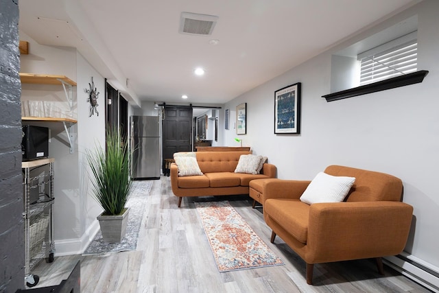 108 Wayne Ave, White Plains, NY 10606 - living area with a barn door, a baseboard heating unit, baseboards, light wood-type flooring, and recessed lighting