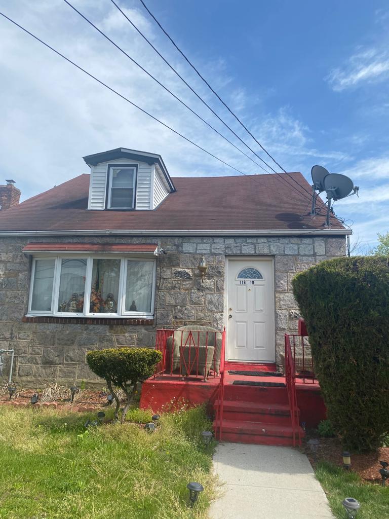116-19 240th St, Elmont, NY 11003 - view of front of home featuring stone siding