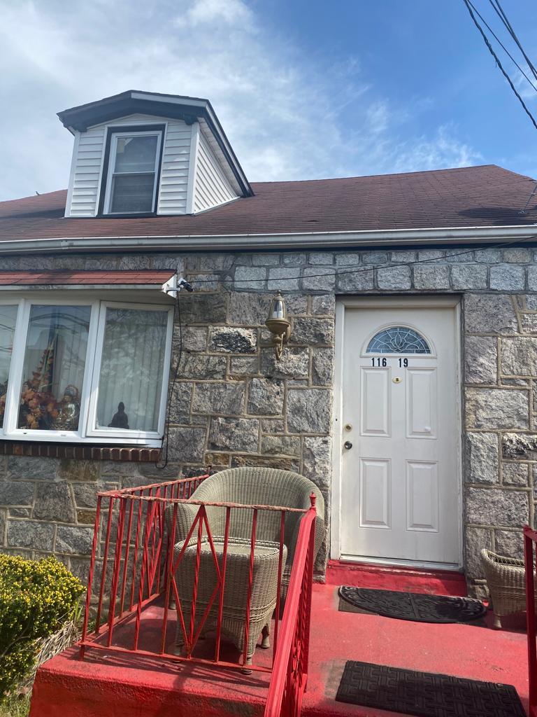 116-19 240th St, Elmont, NY 11003 - doorway to property with stone siding