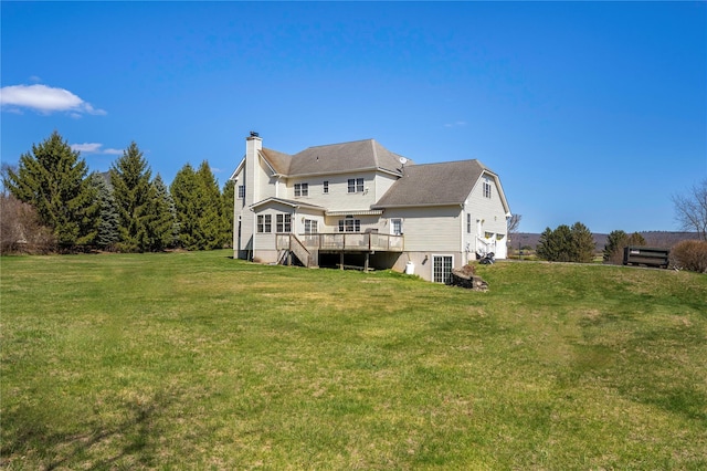 3 Madonna Dr, Lagrangeville, NY 12540 - rear view of house with a deck, a lawn, and a chimney