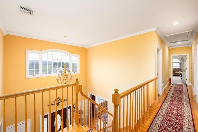 3 Madonna Dr, Lagrangeville, NY 12540 - hall featuring light wood-type flooring, an inviting chandelier, an upstairs landing, crown molding, and visible vents