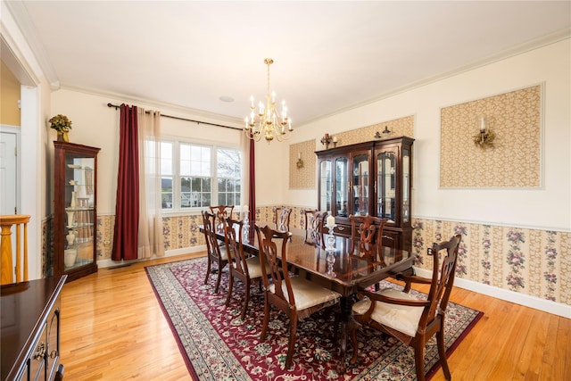 3 Madonna Dr, Lagrangeville, NY 12540 - dining room with a notable chandelier, baseboards, wallpapered walls, light wood-type flooring, and crown molding