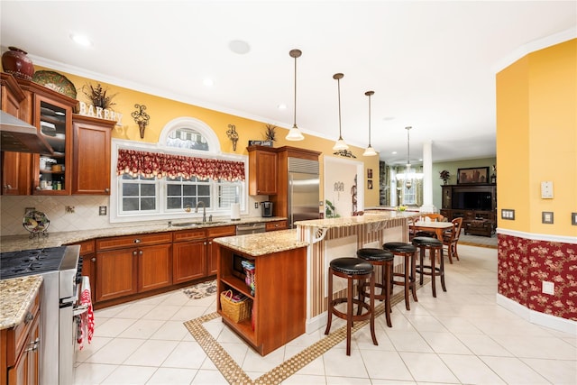 3 Madonna Dr, Lagrangeville, NY 12540 - kitchen featuring a kitchen breakfast bar, a center island, light tile patterned flooring, a sink, and high quality appliances