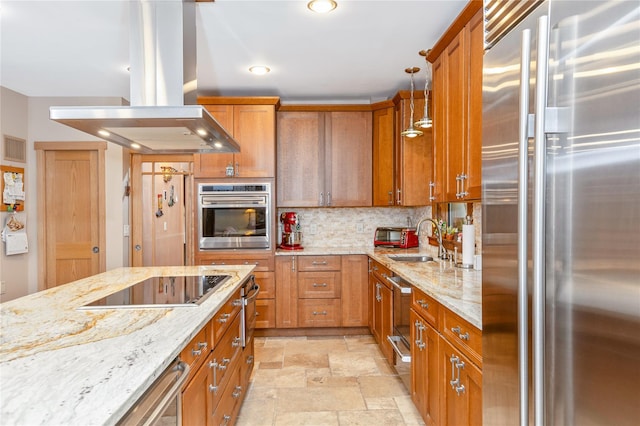 19 Stillwood Rd, Brookhaven, NY 11719 - kitchen with a sink, brown cabinetry, stainless steel appliances, stone finish flooring, and island exhaust hood