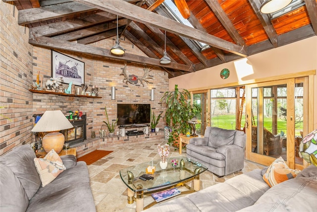 19 Stillwood Rd, Brookhaven, NY 11719 - living room featuring beamed ceiling, brick wall, and stone tile floors