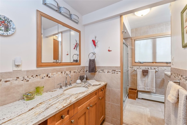 19 Stillwood Rd, Brookhaven, NY 11719 - bathroom with vanity, a shower stall, and tile walls