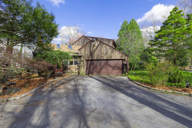 19 Stillwood Rd, Brookhaven, NY 11719 - view of front of house featuring an attached garage and aphalt driveway