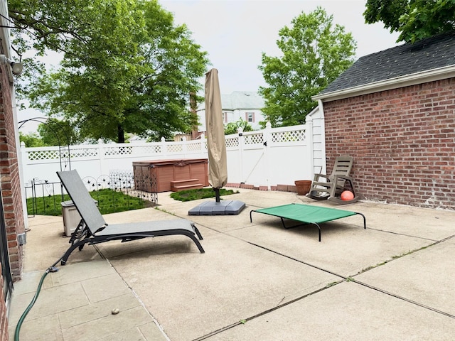 212-04 50th Ave, Bayside, NY 11364 - fenced backyard with a hot tub and a patio area