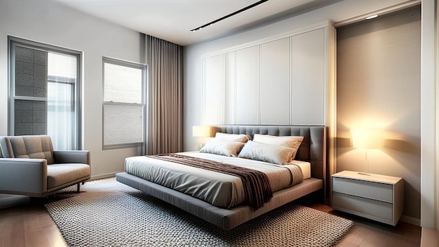 bedroom with light wood finished floors and baseboards