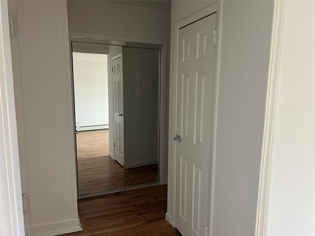 91 Tulip Ave Unit B-2, Floral Park, NY 11001 - hall featuring a baseboard radiator and wood finished floors