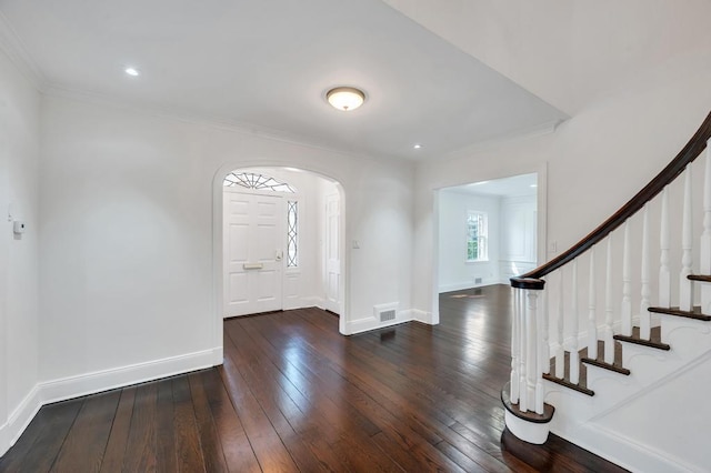 85 Station Rd, Great Neck, NY 11023 - foyer with baseboards, arched walkways, visible vents, and hardwood / wood-style flooring