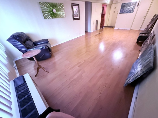 20921 26th Ave Unit 1G, Bayside, NY 11360 - living area featuring wood finished floors and baseboards