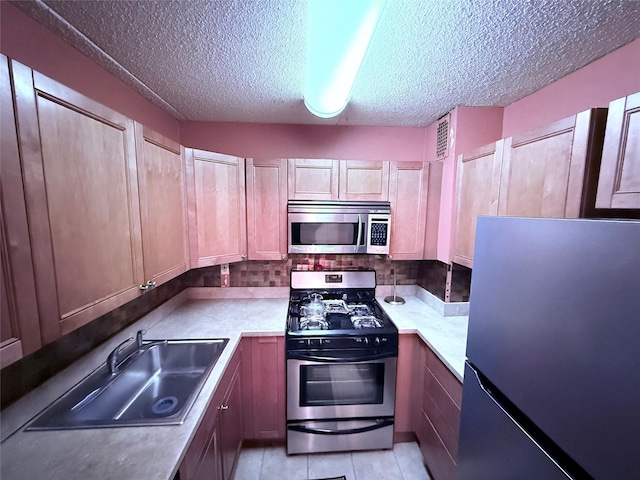20921 26th Ave Unit 1G, Bayside, NY 11360 - kitchen with a sink, light countertops, appliances with stainless steel finishes, and a textured ceiling