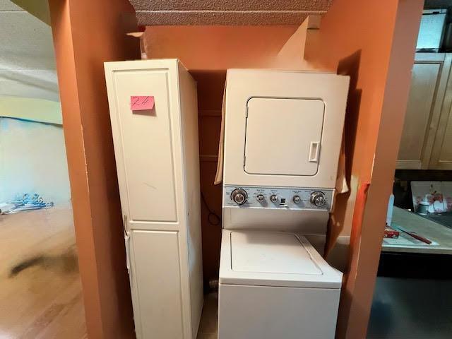 20921 26th Ave Unit 1G, Bayside, NY 11360 - washroom with stacked washing maching and dryer and laundry area