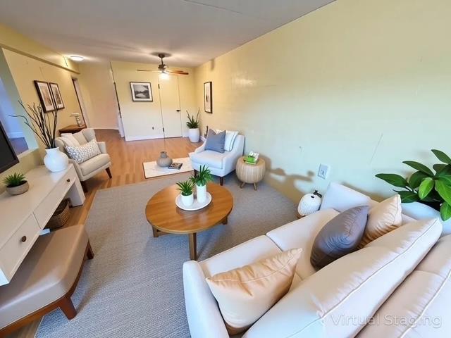 20921 26th Ave Unit 1G, Bayside, NY 11360 - living area featuring ceiling fan and wood finished floors