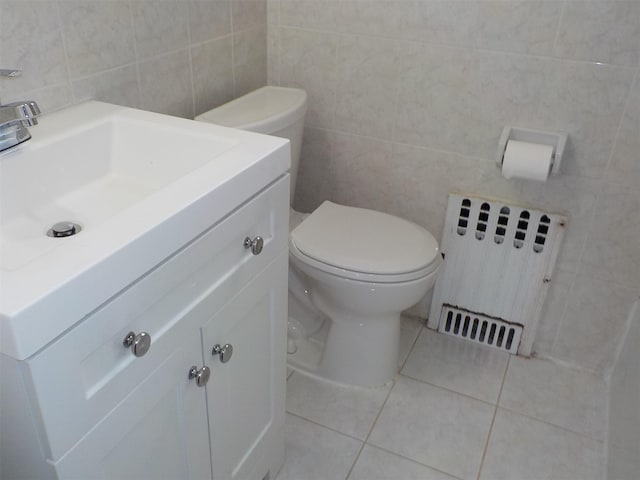 260-37 Union Tpke Fl 2Nd, Glen Oaks, NY 11004 - half bathroom featuring vanity, toilet, tile patterned floors, radiator, and tile walls