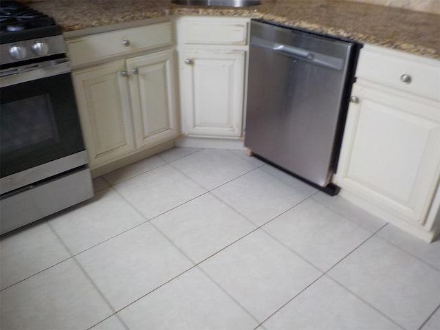 260-37 Union Tpke Fl 2Nd, Glen Oaks, NY 11004 - kitchen with stainless steel appliances, a sink, cream cabinetry, and light tile patterned floors
