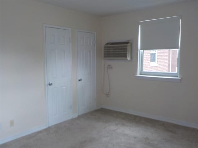 260-37 Union Tpke Fl 2Nd, Glen Oaks, NY 11004 - interior space featuring baseboards, an AC wall unit, and carpet flooring