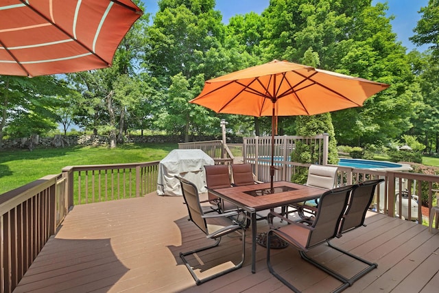 34 Melissa Ln, Washingtonville, NY 10992 - deck with outdoor dining space, a lawn, view of scattered trees, grilling area, and an outdoor pool
