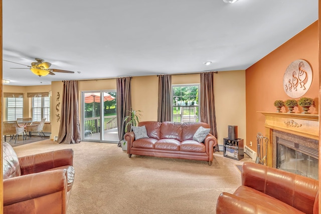 34 Melissa Ln, Washingtonville, NY 10992 - carpeted living area with healthy amount of natural light, a fireplace, ceiling fan, and a baseboard radiator