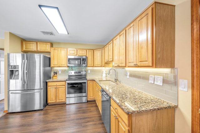 34 Melissa Ln, Washingtonville, NY 10992 - kitchen with appliances with stainless steel finishes, light stone counters, dark wood-type flooring, and backsplash