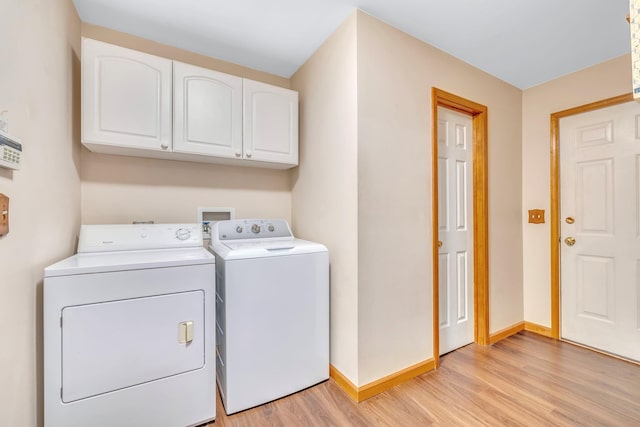 34 Melissa Ln, Washingtonville, NY 10992 - laundry room featuring cabinet space, washing machine and clothes dryer, and light wood finished floors