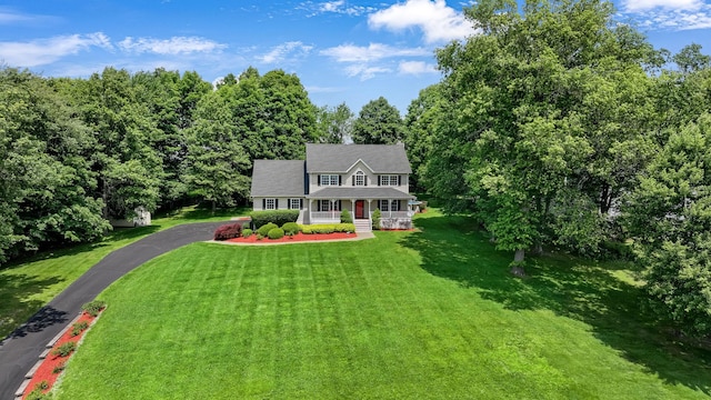 34 Melissa Ln, Washingtonville, NY 10992 - colonial house featuring covered porch, a front lawn, and driveway