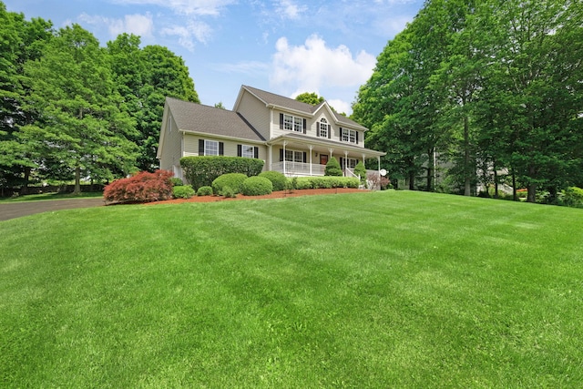 34 Melissa Ln, Washingtonville, NY 10992 - colonial-style house featuring covered porch and a front yard
