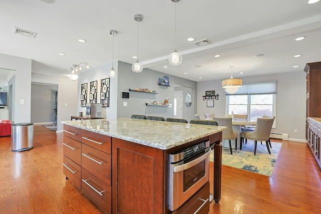 kitchen with visible vents, light wood-type flooring, and recessed lighting