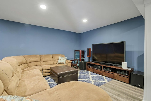 living room with recessed lighting and wood finished floors