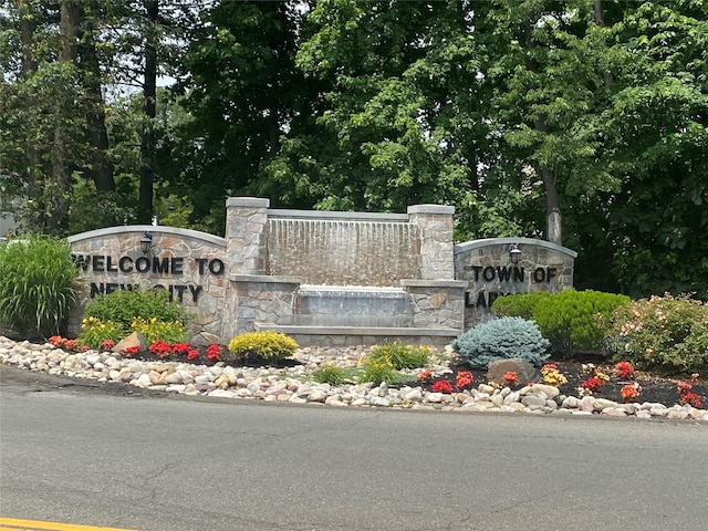 community sign with fence