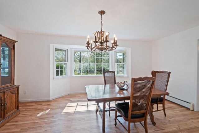 4 Penn Ct, Dix Hills, NY 11746 - dining room with a baseboard heating unit, a chandelier, light wood finished floors, and baseboards