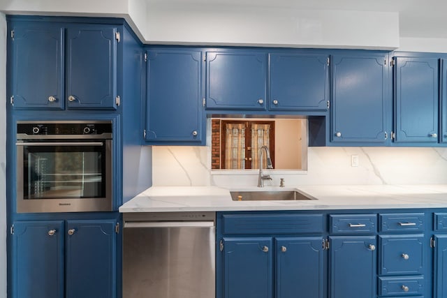 4 Penn Ct, Dix Hills, NY 11746 - kitchen featuring appliances with stainless steel finishes, a sink, blue cabinetry, and light countertops
