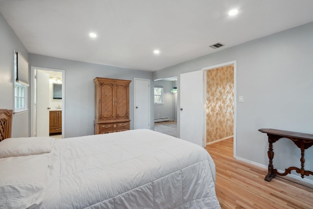 4 Penn Ct, Dix Hills, NY 11746 - bedroom featuring visible vents, baseboards, ensuite bathroom, light wood-style floors, and a baseboard radiator