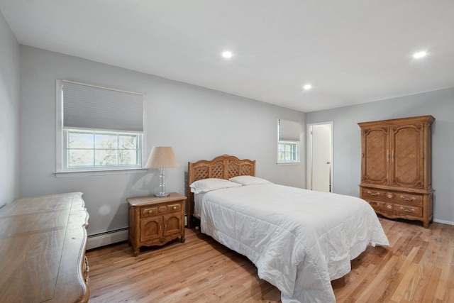 4 Penn Ct, Dix Hills, NY 11746 - bedroom with a baseboard heating unit, recessed lighting, and light wood-type flooring