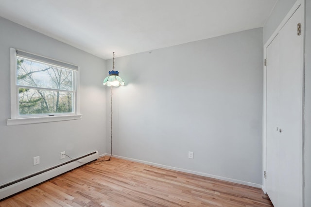 4 Penn Ct, Dix Hills, NY 11746 - interior space featuring a baseboard heating unit, baseboards, and light wood finished floors