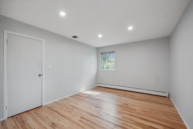 4 Penn Ct, Dix Hills, NY 11746 - empty room with baseboard heating, recessed lighting, baseboards, visible vents, and wood finished floors