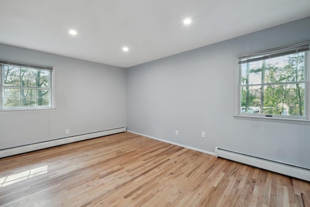 4 Penn Ct, Dix Hills, NY 11746 - spare room featuring a baseboard radiator, baseboard heating, recessed lighting, baseboards, and wood finished floors