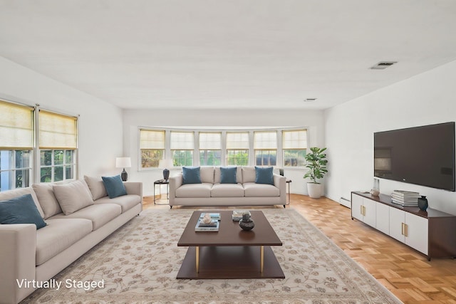 4 Penn Ct, Dix Hills, NY 11746 - living area with plenty of natural light and a baseboard radiator