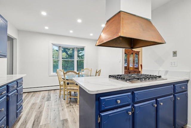 4 Penn Ct, Dix Hills, NY 11746 - kitchen with stainless steel gas stovetop, baseboard heating, island range hood, blue cabinets, and light wood finished floors