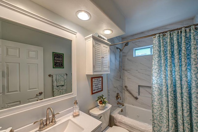 full bath featuring toilet, shower / bath combo with shower curtain, and vanity