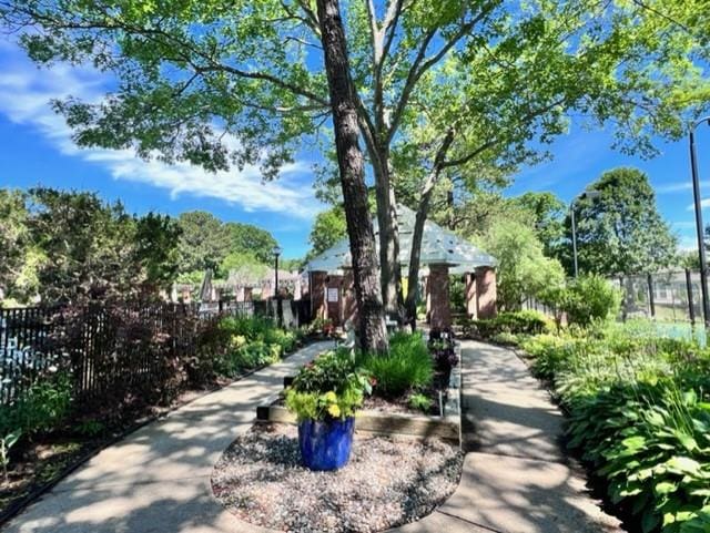 view of community featuring fence