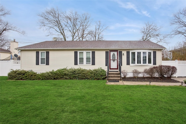 5 Bonny Dr, Mastic, NY 11950 - view of front of house featuring entry steps, roof with shingles, fence, and a front lawn