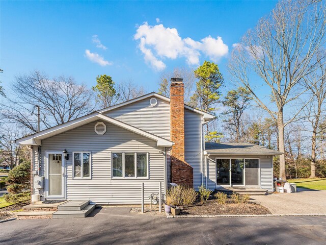 1170 Carlls Straight Path, Dix Hills, NY 11746 - view of front of home featuring a chimney